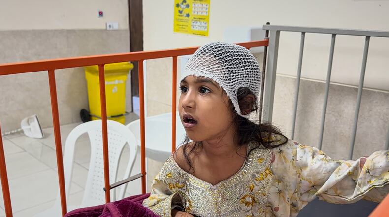 A child wounded, according to Tasnim news agency, in a strike on a home where a wedding was being held in Kuhestak, southern Iran, receives treatment at a hospital in Menab, Iran, early Wednesday, Sept.2, 2026. (Morteza Akhoondi/Tasnim News Agency via AP)