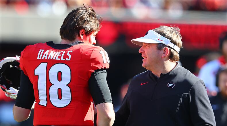 112021 Athens: Georgia head coach Kirby Smart and quarterback JT Daniels confer during the second quarter against Charleston Southern in a NCAA college football game on Saturday, Nov. 20, 2021, in Athens.    “Curtis Compton / Curtis.Compton@ajc.com”