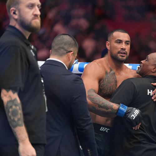 Carlos Ulberg, center, of New Zealand, reacts after defeating Jiri Prochazka, of Czechia, by TKO to win their light heavyweight title bout at a UFC 327 mixed martial arts event, Saturday, April 11, 2026, in Miami. (AP Photo/Rebecca Blackwell)