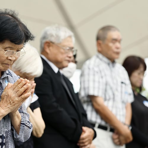 People observe a minute of silence during a ceremony to mark the 81st anniversary of the U.S. atomic bombing at the Peace Park in Nagasaki, southern Japan Sunday, Aug. 9, 2026. (Taichi Nagahisa/Kyodo News via AP)