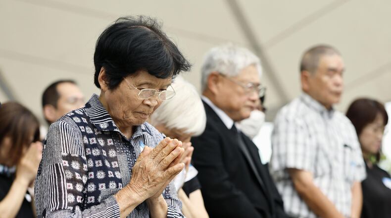 People observe a minute of silence during a ceremony to mark the 81st anniversary of the U.S. atomic bombing at the Peace Park in Nagasaki, southern Japan Sunday, Aug. 9, 2026. (Taichi Nagahisa/Kyodo News via AP)