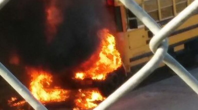 No children were on the bus, and the driver was able to escape without injuries, authorities said.