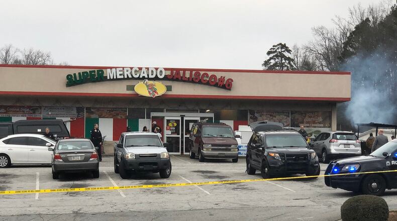 A man was shot and killed Saturday afternoon in the parking lot of a Roswell supermarket, police said.