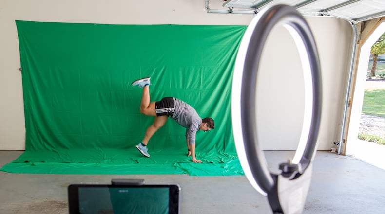 Springdale Park Elementary School teacher Jen Hagerty records physical education videos in her Marietta garage on Oct. 7, 2020. Hagerty uses equipment provided to her by the school's parent-teacher organization. (Jenni Girtman for The Atlanta Journal-Constitution)