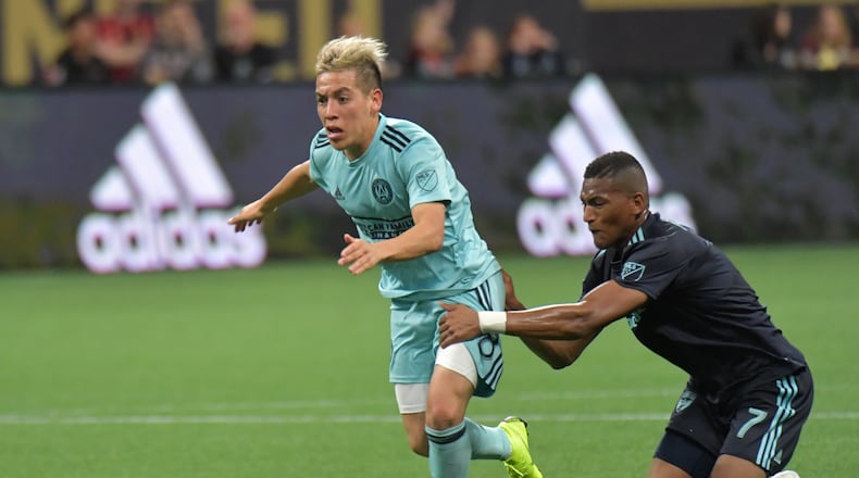 April 20, 2019 Atlanta - Atlanta United midfielder Ezequiel Barco (8) is fouled by FC Dallas midfielder Carlos Gruezo (7) during the second half in a MLS soccer match at Mercedes-Benz Stadium in Atlanta on Saturday, April 20, 2019. FC Dallas won 2-1 over the Atlanta United. HYOSUB SHIN / HSHIN@AJC.COM