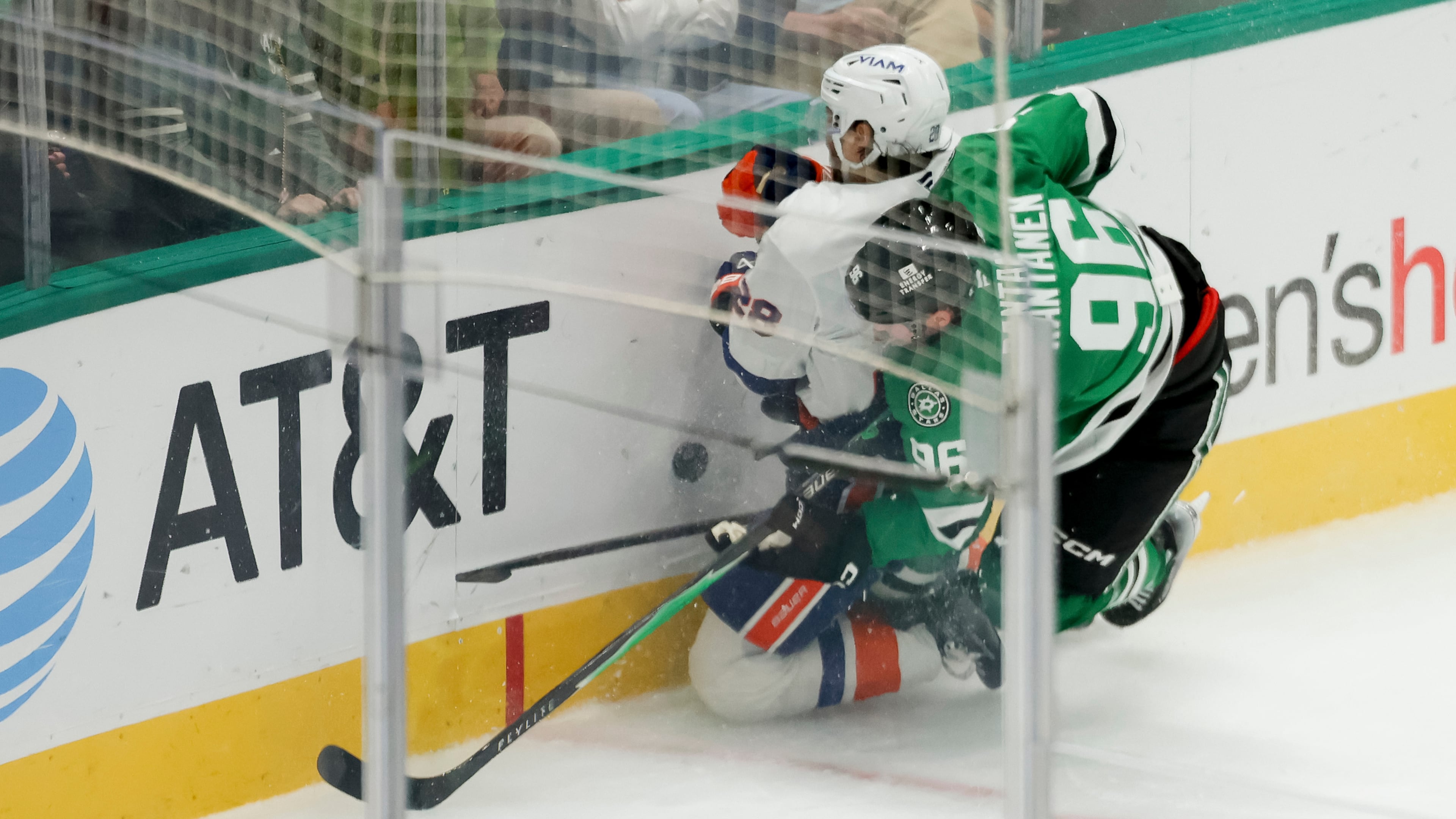 Dallas Stars right wing Mikko Rantanen (96) collides with New York Islanders defenseman Alexander Romanov (28) during the third period of an NHL hockey game, Tuesday, Nov. 18, 2025, in Dallas. (AP Photo/Gareth Patterson)