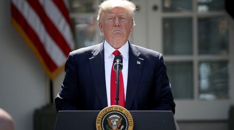 WASHINGTON, DC - JUNE 01:  U.S. President Donald Trump concludes his announcement to withdraw the United States from the Paris climate agreement in the Rose Garden at the White House June 1, 2017 in Washington, DC. Trump pledged on the campaign trail to withdraw from the accord, which former President Barack Obama and the leaders of 194 other countries signed in 2015. The agreement is intended to encourage the reduction of greenhouse gas emissions in an effort to limit global warming to a manageable level.  (Photo by Win McNamee/Getty Images)