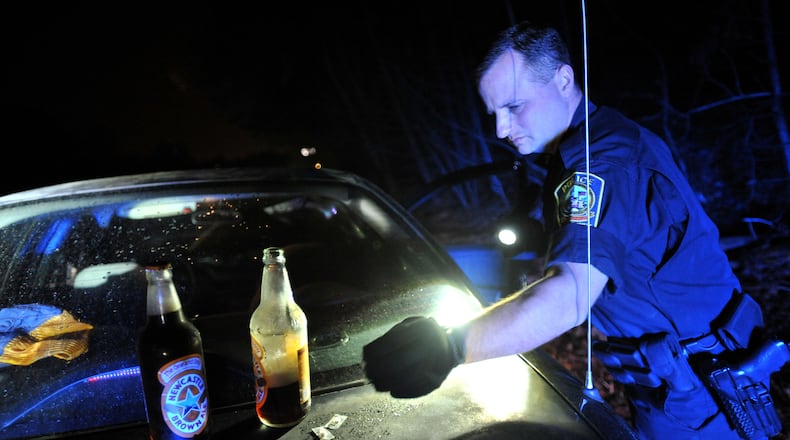 Lawrenceville police make a traffic stop of a driver suspected of driving under the influence. (Hyosub Shin/AJC FILE PHOTO 2012)
