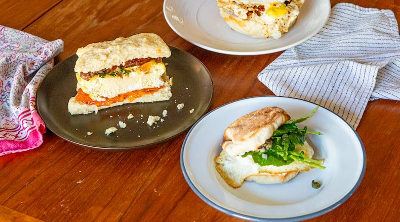 Breakfast sandwiches can come in a range of complexity and richness. Clockwise, from left: Sheet Pan Bacon, Egg and Cheese Sandwich, Sweet and Savory Biscuit Sandwich, and Egg and Cream Cheese Breakfast Sandwich with Kale Salad. (Aaliyah Man for The Atlanta Journal-Constitution / Food styling by Kate Williams)