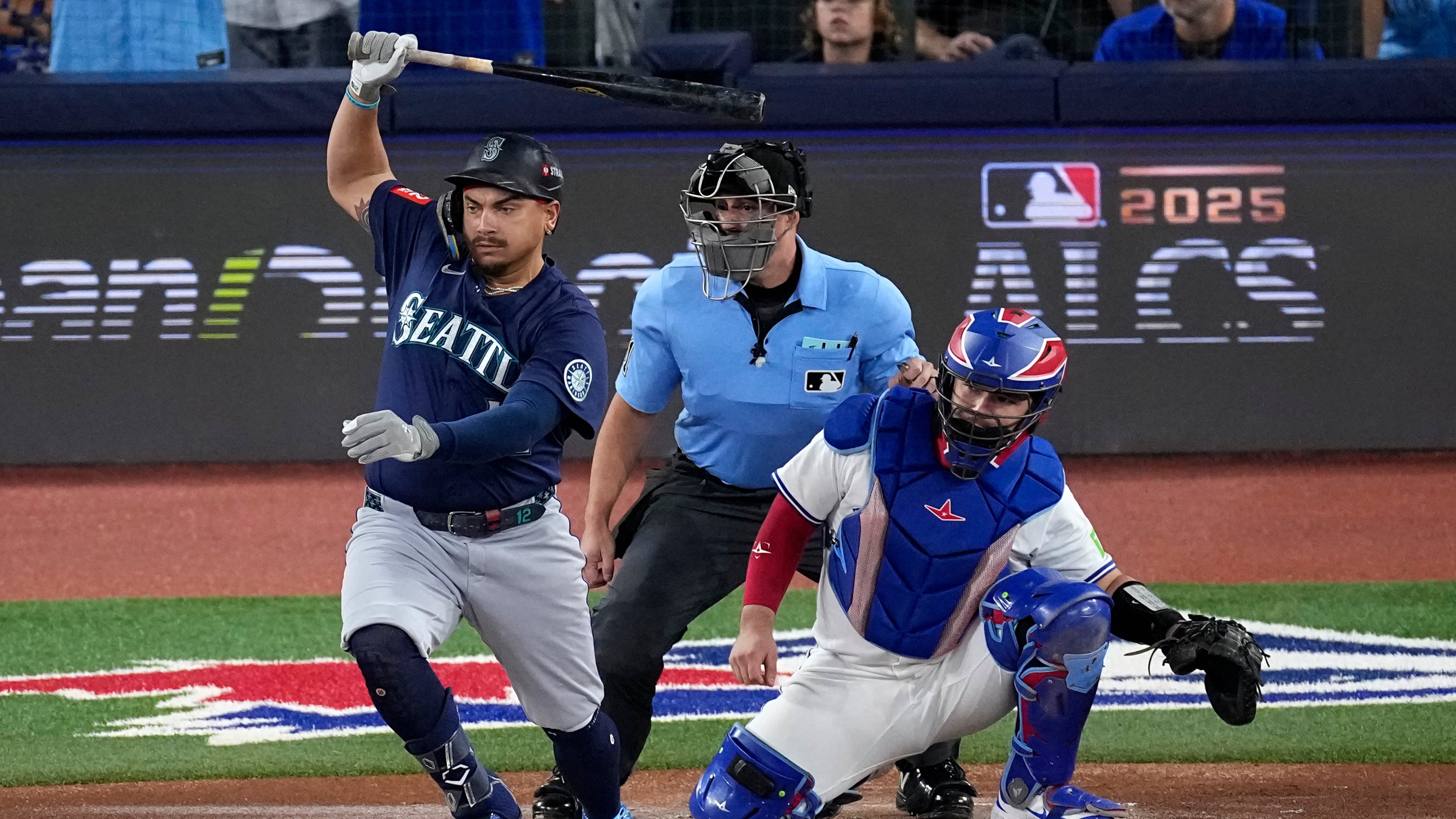 Seattle Mariners' Josh Naylor follows through on an RBI base hit off Toronto Blue Jays pitcher Shane Bieber (57) during the first inning in Game 7 of baseball's American League Championship Series, Monday, Oct. 20, 2025, in Toronto. (AP Photo/David J. Phillip)