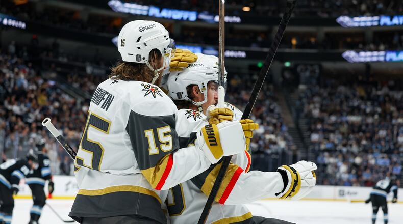 Vegas Golden Knights defenseman Noah Hanifin (15) and right wing Mitch Marner (93) celebrate a goal against the Utah Mammoth during the second period of Game 6 in the first round of an NHL hockey Stanley Cup playoff series, Friday, May 1, 2026, in Salt Lake City. (AP Photo/Melissa Majchrzak)
