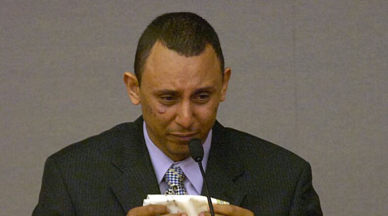 Khalid Adem cried during his testimony during his 2006 trial in Gwinnett County. After serving 10 years in prison he has been deported back to Ethiopia.  (AJC file photo)