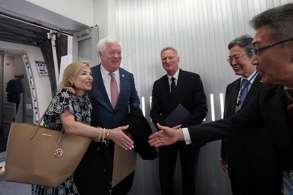 U.S. Ambassador to Japan George Glass, second left, and his wife Mary, left, are welcomed by Joseph Young, center, Acting Deputy Chief of Mission at the US Embassy in Tokyo, Eiichi Kawahara, second right, Ambassador Special Assistant to the Minister for Foreign Affairs, and Victor Osumi, right, President of Japan Operations of Delta, upon their arrival at Haneda Airport in Tokyo Friday, April 18, 2025. (Kazuhiro Nogi/Pool Photo via AP)