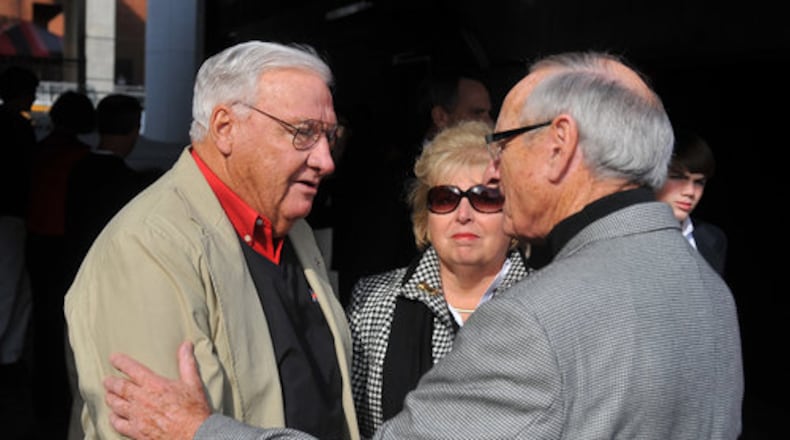 Former UGA coach and athletics director Vince Dooley talks with Sonny Seiler, the long-time owner of the Georgia mascots, and Seiler's daughter Swann.