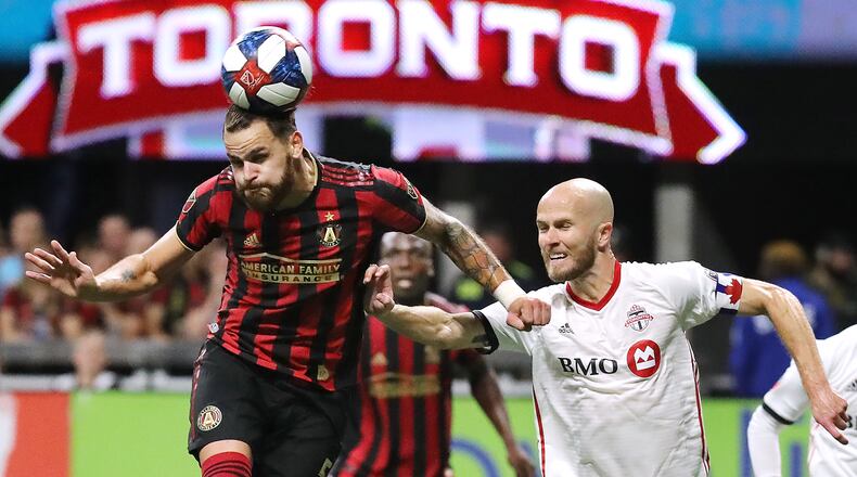 October 30, 2019 Atlanta: Atlanta United defender Leandro Gonzalez Pirez gets a header against Toronto FC midfielder Michael Bradley in the Eastern Conference Final on Wednesday, October 30, 2019, in Atlanta. Curtis Compton/ccompton@ajc.com