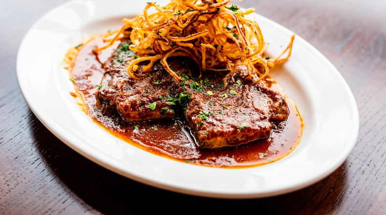 Daube — a homestyle pot roast, of brisket braised for hours — is complemented by a garnish of crisped onions at Lagarde American Eatery. CONTRIBUTED BY HENRI HOLLIS