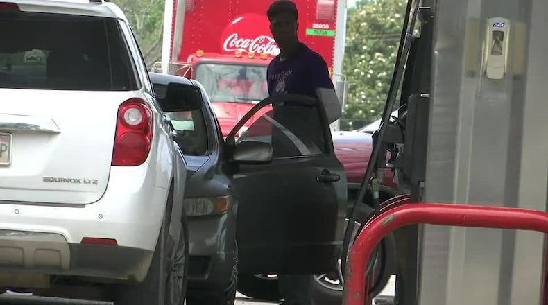 A motorist at a gas station