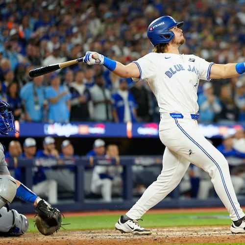 Toronto Blue Jays' Addison Barger watches his grand slam against the Los Angeles Dodgers during the sixth inning of Game 1 of baseball's World Series in Toronto, Friday, Oct. 24, 2025. (Frank Gunn/The Canadian Press via AP)
