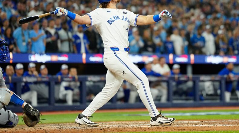 Toronto Blue Jays' Addison Barger watches his grand slam against the Los Angeles Dodgers during the sixth inning of Game 1 of baseball's World Series in Toronto, Friday, Oct. 24, 2025. (Frank Gunn/The Canadian Press via AP)