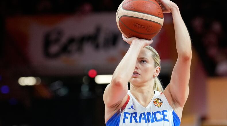 France's Marine Johannes shoots during the Women's Basketball World Cup match between France and Korea in Berlin, Saturday, Sept. 5, 2026. (AP Photo/Ebrahim Noroozi)