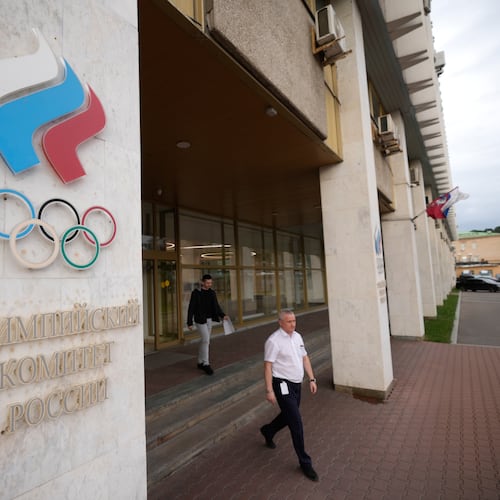 A man walks from the Russian National Olympic Committee building in Moscow, on Tuesday, July 7, 2026. (AP Photo/Pavel Bednyakov)