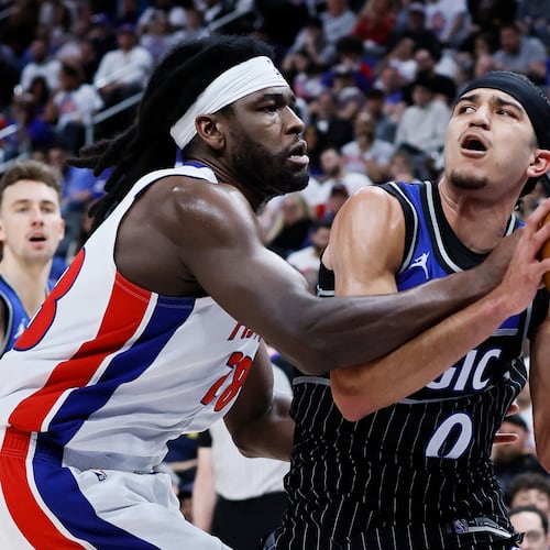 Orlando Magic guard Anthony Black (0) is fouled by Detroit Pistons forward Isaiah Stewart (28) while driving to the basket during the second half in Game 2 of a first-round NBA basketball playoffs series Wednesday, April 22, 2026, in Detroit. (AP Photo/Duane Burleson)