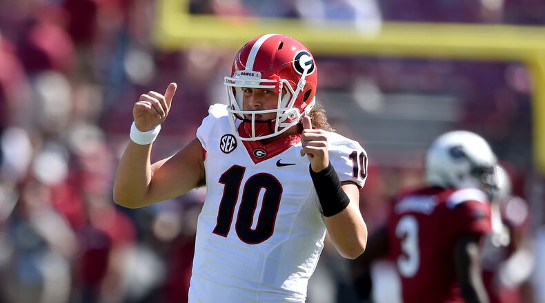 October 9, 2016 Columbia, SC: Georgia Bulldogs quarterback Jacob Eason gives a thumbs up a receiver, indicating he was finished warming up. Georgia Bulldogs take on the South Carolina Gamecocks Sunday October 9, 2016 at Williams- Brice Stadium in Columbia, SC. The game was delayed one day due to hurricane Matthew which hit the East Coast, including much of South Carolina BRANT SANDERLIN/BSANDERLIN@AJC.COM