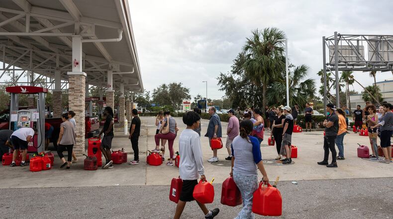 Extreme weather is resulting in the next great migration of Americans as residents in coastal areas seek refuge in cities like Atlanta. Here people wait in line to get gas at a filling station near Bradenton, Fla., after Hurricane Milton, Oct. 11, 2024. (Caitlin Ochs/The New York Times)