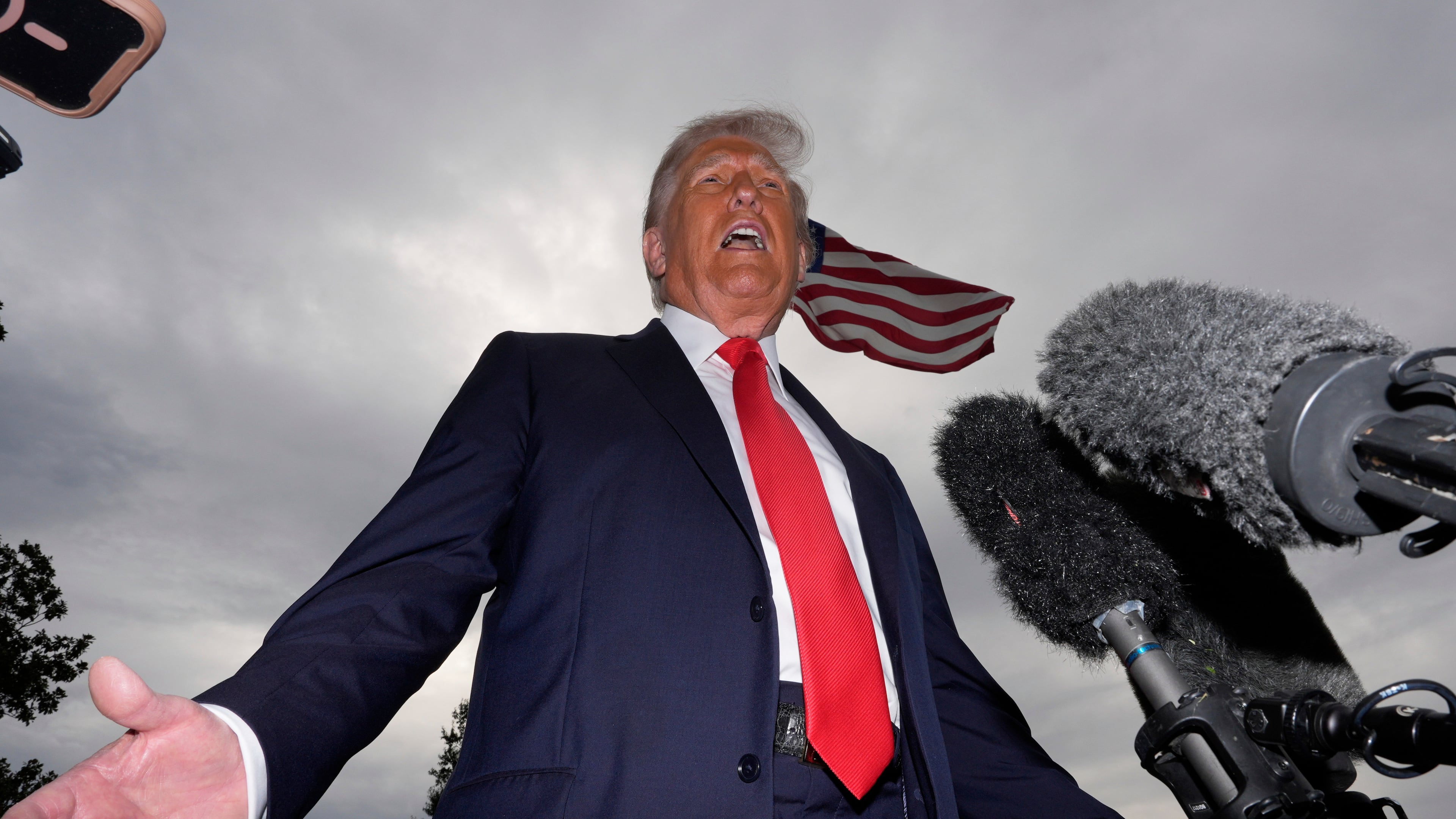 President Donald Trump speaks with reporters before departing on Marine One from the South Lawn of the White House, Tuesday, Sept. 16, 2025, in Washington. (AP Photo/Alex Brandon)