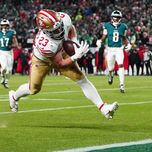 San Francisco 49ers running back Christian McCaffrey scores a touchdown during the second half of an NFL wild-card playoff football game against the Philadelphia Eagles on Sunday, Jan. 11, 2026, in Philadelphia. (AP Photo/Derik Hamilton)