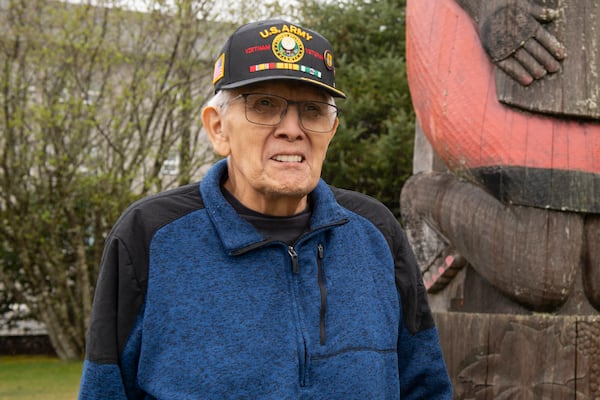 George Bennett stands in front of a totem on the Southeast Alaska Health Consortium campus in Sitka, Alaska, Monday, April 28, 2025. (James Poulson/The Daily Sitka Sentinel via AP)