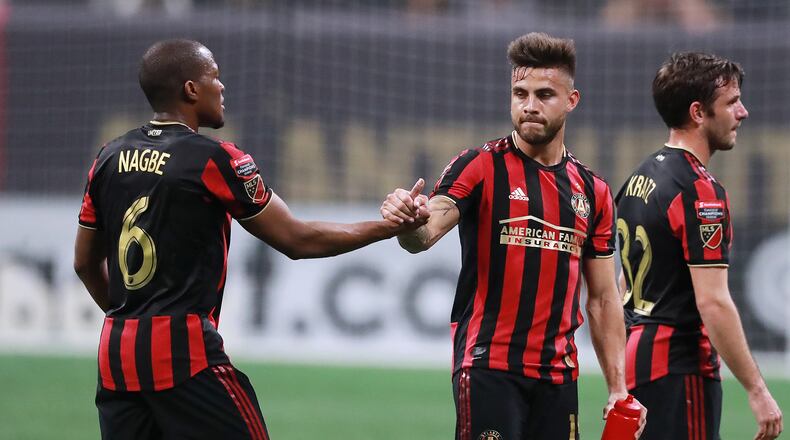 March 13, 2019 Atlanta: Atlanta United midfielder Darlington Nagbe (left) gets five from Hector Villalba as time expires against Monterrey during the second half in a Concacaf Champions league quarterfinal match on Wednesday, March 13, 2019, in Atlanta. Atlanta United won the match 1-0 but failed to advance. Curtis Compton/ccompton@ajc.com