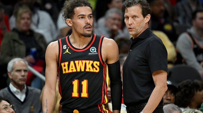 Atlanta Hawks head coach Quin Snyder confers with Atlanta Hawks' guard Trae Young (11) during the first half in an NBA basketball game at State Farm Arena, Tuesday, March 28, 2023, in Atlanta. (Hyosub Shin / Hyosub.Shin@ajc.com)