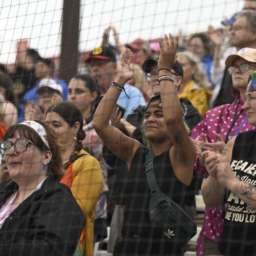 Fans cheer before the inaugural Women's Professional Baseball League game between the Los Angeles Queens and the New York Heights, Saturday, Aug. 1, 2026, in Springfield, Ill. (AP Photo/Lexie Knight)