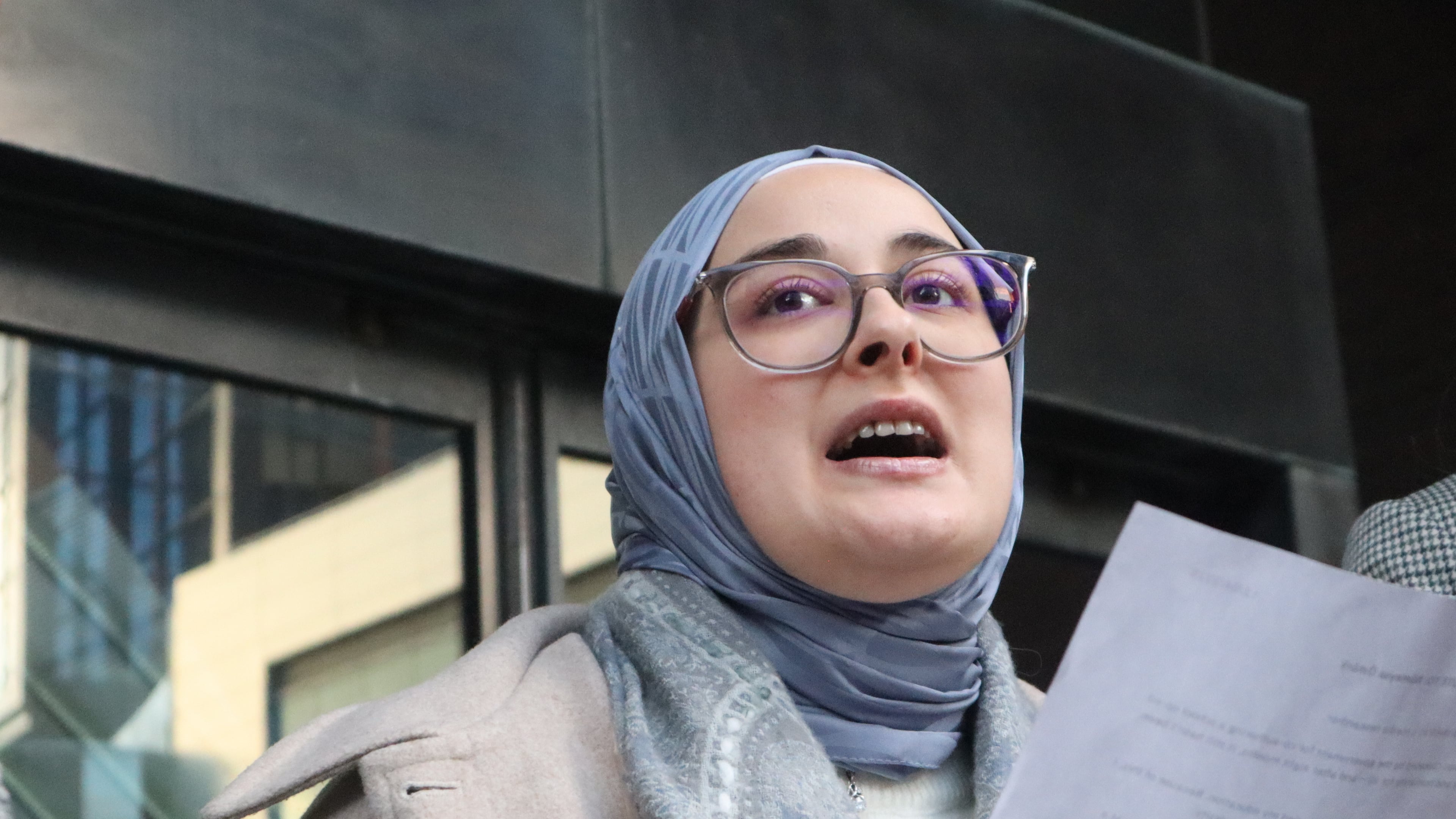Tufts University doctoral student Rumeysa Ozturk reads from a prepared statement following a court hearing outside the John Joseph Moakley United States Courthouse Thursday, Dec. 4, 2025, in Boston. (AP Photo/Leah Willingham)