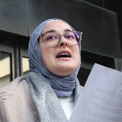 Tufts University doctoral student Rumeysa Ozturk reads from a prepared statement following a court hearing outside the John Joseph Moakley United States Courthouse Thursday, Dec. 4, 2025, in Boston. (AP Photo/Leah Willingham)