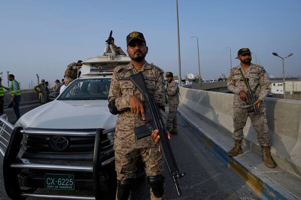 A paramilitary soldier stand alert on a road near Karachi port following raising military tension between Pakistan and India, in Karachi, Pakistan, Friday, May 9, 2025. (AP Photo/Fareed Khan)