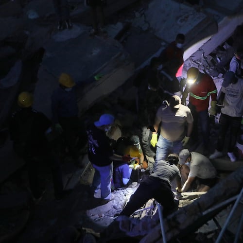 People search through the rubble after an earthquake struck Cali, Colombia, Monday, Aug. 10, 2026. (AP Photo/Santiago Saldarriaga)