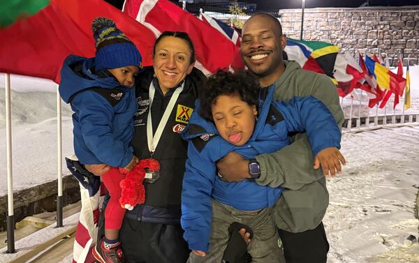 Elana Meyers Taylor and her husband Nic Taylor hold their children (from left) Noah, 3, and Nico, 5. (Courtesy of Elana Meyers Taylor)