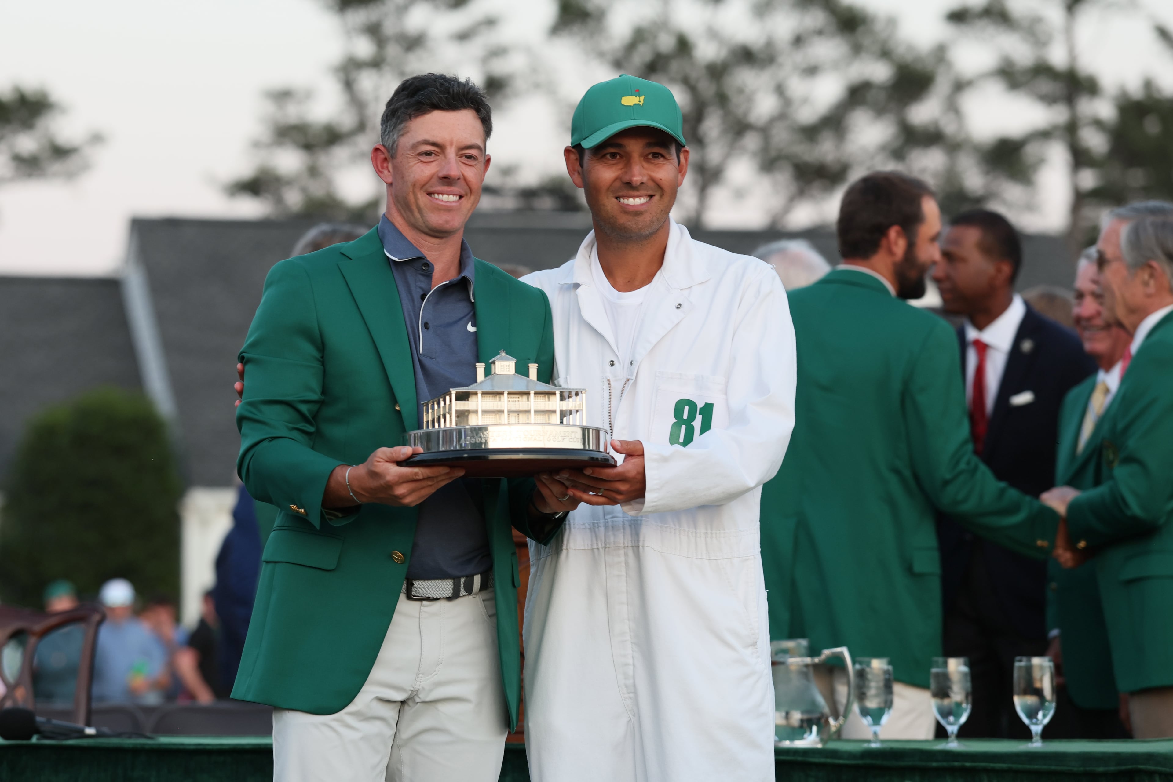 Rory McIlroy celebrates winning the Masters golf tournament with caddie Harry Diamond at Augusta National Golf Club, Sunday, April 13, 2025, in Augusta, Ga. (Jason Getz / AJC)