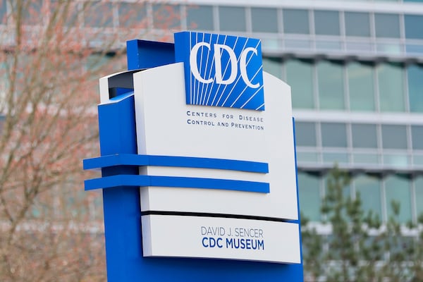 A sign with the CDC logo is displayed at the entrance to the agency's headquarters in Atlanta on March 2, 2025. (Miguel Martinez/AJC)