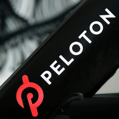 FILE - The Peloton logo is seen on the company's stationary bicycle in San Francisco, Calif., Nov. 19, 2019. (AP Photo/Jeff Chiu, File)