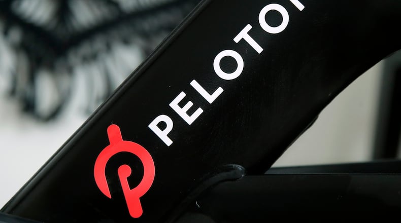 FILE - The Peloton logo is seen on the company's stationary bicycle in San Francisco, Calif., Nov. 19, 2019. (AP Photo/Jeff Chiu, File)