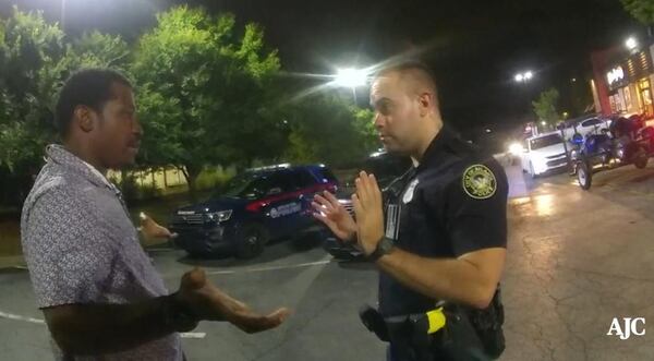 Rayshard Brooks talks with Atlanta Police Officer Garrett Rolfe in a Wendy's parking lot on June 12, 2020, before the confrontation turns violent and Rolfe shoots Brooks in the back, killing him. (Contributed)