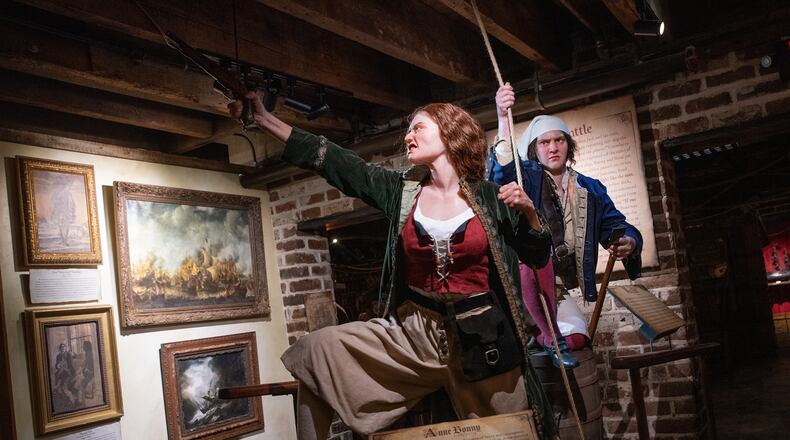 An exhibit in the Savannah Pirates and Treasure Museum depicts Anne Bonny (center) and Mary Read, who were among the few female pirates during the Golden Age of Piracy. (Courtesy of Travis Spagenhurg)
