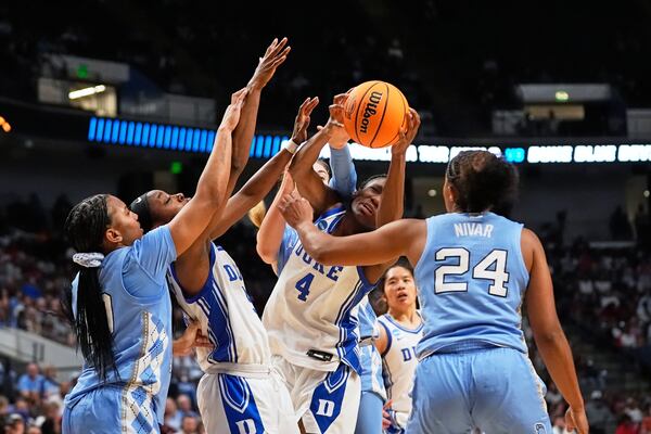 Duke guard Jadyn Donovan (4) battles under the basket during the second half against North Carolina in the Sweet 16 of the NCAA college basketball tournament, Friday, March 28, 2025, in Birmingham, Ala. (AP Photo/Gerald Herbert)