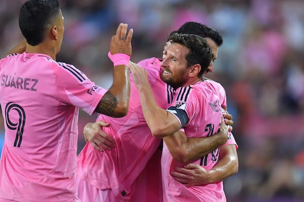 Inter Miami forward Lionel Messi, front, right, celebrates with forward Luis Suárez, left, and teammates after Messi scored in the first half of an MLS soccer match against the New England Revolution, Wednesday, July 9, 2025, in Foxborough, Mass. (AP Photo/Steven Senne)