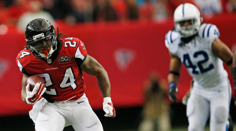 Atlanta Falcons running back Devonta Freeman (24) runs against the Indianapolis Colts during the first of an NFL football game, Sunday, Nov. 22, 2015, in Atlanta. (AP Photo/John Bazemore)