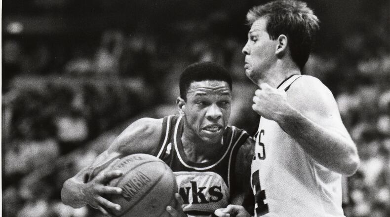 Glenn Rivers of the Atlanta Hawks tries to drive past Danny Ainge of the Boston Celtics in the second quarter of Game 1 in the second round of the NBA playoffs Wednesday night in the Boston Garden. AJC file/William Berry