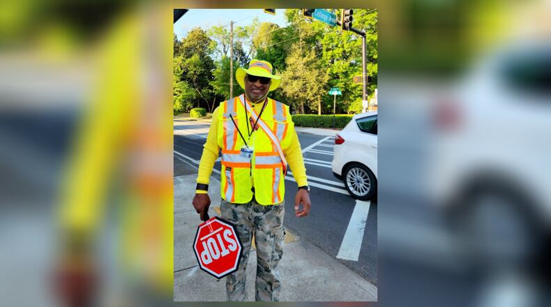 School crossing guard Jeffery Smith was back at work in Decatur on Monday after he was injured in a crash in September, police said.